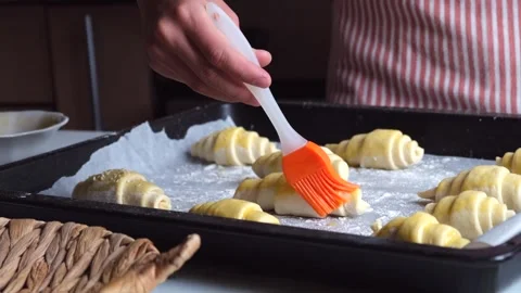 Cooking croissants or bagels or baking at home, child in the kitchen doing Stock Footage 275818655