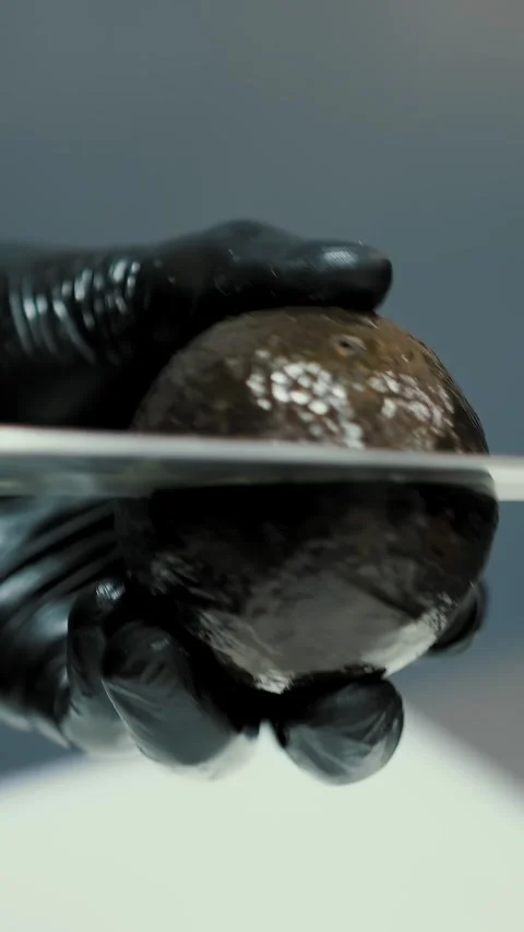 Cooking. Culinary. avocado. close-up. the cook cuts a fresh avocado into half, Stock Footage 315755709