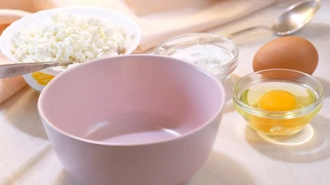 Cooking a curd casserole/a pie Stock Footage 98043944