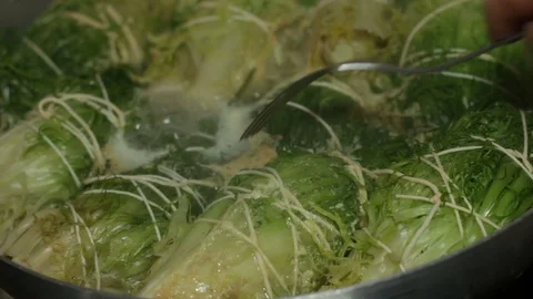 Cooking the curly endive a typical Neapolitan dish of peasant origin. Stock Footage 129396013