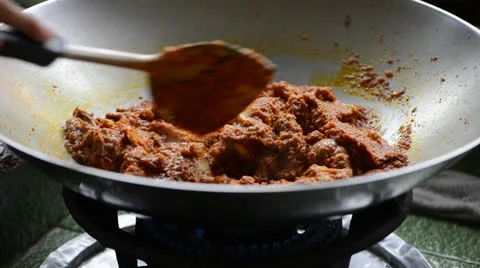 Cooking curry chicken Stock Footage 26181071