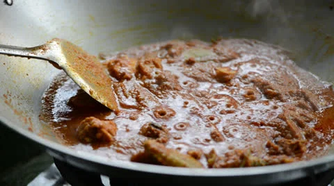 Cooking curry chicken Stock Footage 26181106