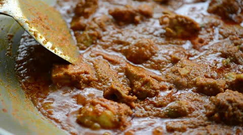 Cooking curry chicken Stock Footage 26181149