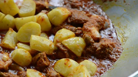 Cooking curry chicken Stock Footage 26181260