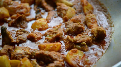 Cooking curry chicken Stock Footage 26181368