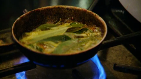 Cooking Curry Leaf in Frying Pan Stock Footage 106896275