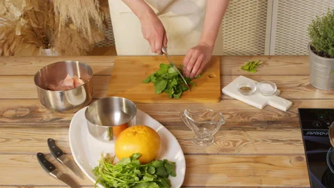 Cooking. Cut vegetables. Close up of cooking. Hands cut greens Stock Footage 162619982