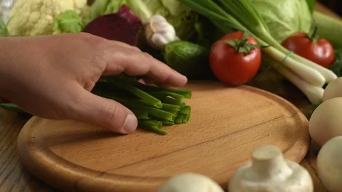 Cooking. Cutting green onions Stock Footage 75968121