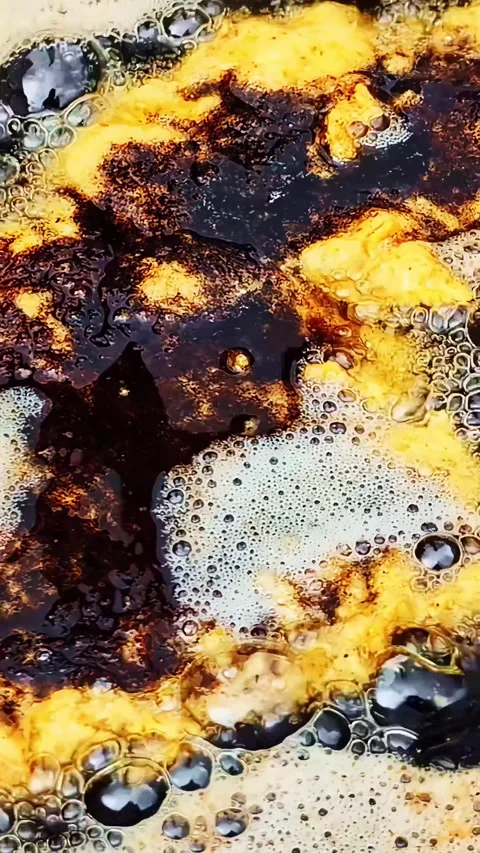Cooking dark aromatic soy sauce with scrambled eggs in a hot oily pan close u Stock Footage 337474622
