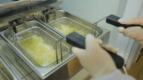 Cooking in the deep fryer Stock Footage 85626305