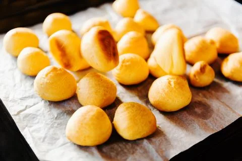 Cooking dessert. A tray with fresh eclair bakery products puff pastry with fa Stock-Fotos