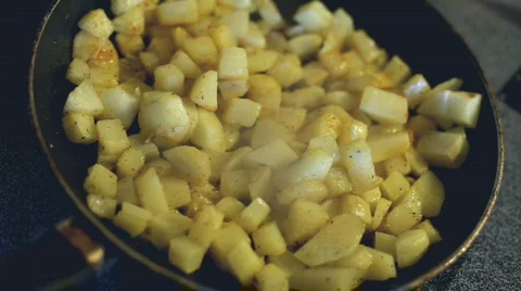 Cooking Diced potatoes on stove Stock Footage