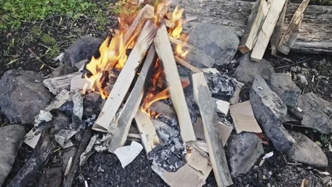 Cooking dinner on the fire 스톡 동영상 285543657