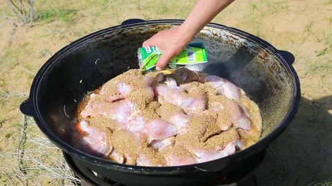 Cooking the dish in the cauldron Video stock 245365199