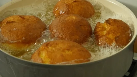 Cooking donuts on oil Stock Footage 103286112