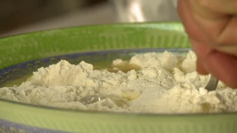 Cooking dough. View of chef add water to flour Stock Footage 70862003