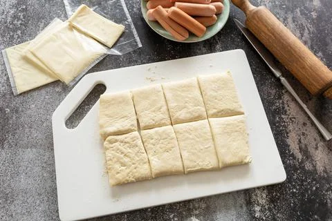 Cooking Easter rabbit-shaped buns puff pastry from sausage and cheese, step.. Stock Photos