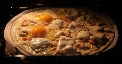 Cooking egg and cheeese pizza in the oven. Stock Footage 102406449