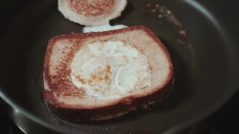 Cooking egg and a hole 60fps flipped Stock Footage 305604083