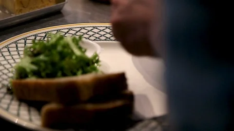 Cooking egg omelet with cherry tomatoes in a frying pan. Stock Footage 96475886
