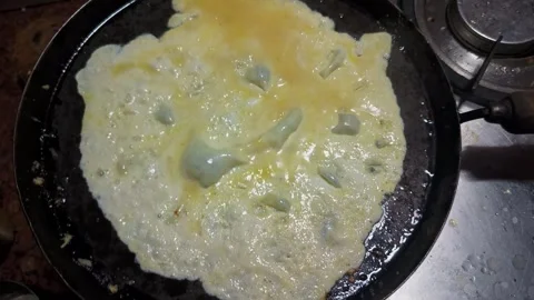 Cooking Egg Omelette on Pan Stock Footage 313148954