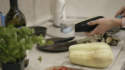 Cooking eggplant in the kitchen Stock Footage 153376921