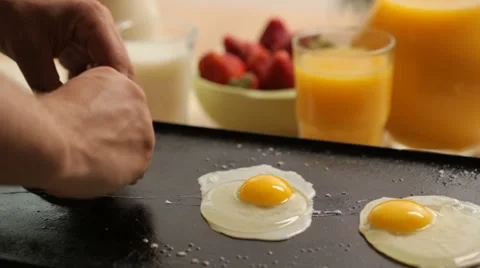 Cooking eggs for breakfast Stock Footage