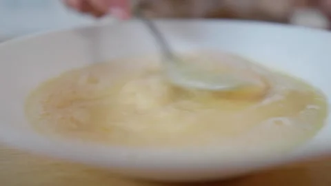 Cooking eggs. Cracking and beating eggs. Useful food. Chicken eggs. Stock Footage 276294124