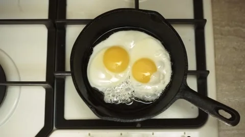 Cooking eggs in a frying pan. Stock Footage 85812215