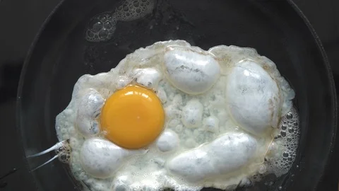 Cooking eggs in hot butter Stock Footage 89448286