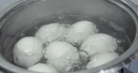 Cooking eggs in the kitchen Stock Footage 145520200
