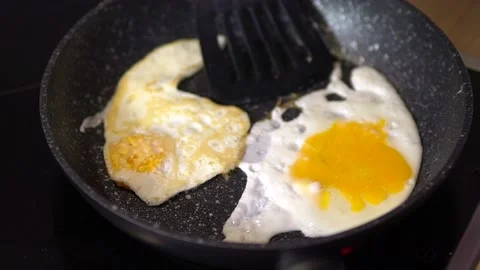Cooking Eggs In A Pan Stock Footage 235471158