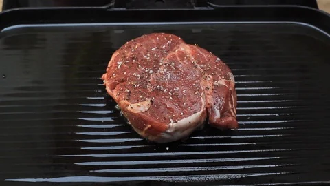 Cooking Fillet Steak on a Griddle Stock Footage 122361300