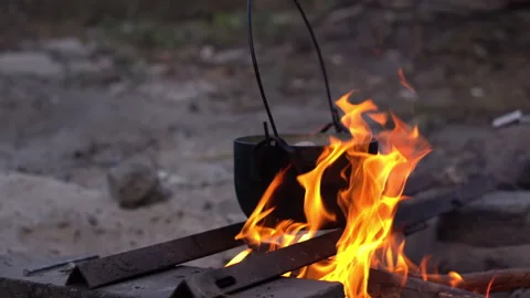 Cooking on a fire, camp, pot Stock Footage 284247752