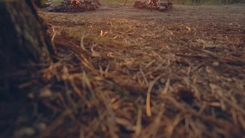 Cooking on fire . In a cast iron pot over a fire on the lake. Cooking outdoors Stock Footage 76200929