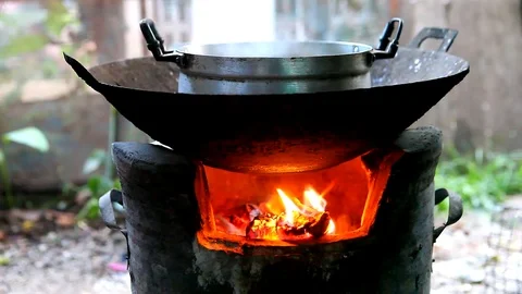 Cooking on a fire Stock Footage 76480692