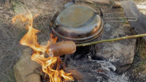 Cooking on fire Stock Footage 88720109