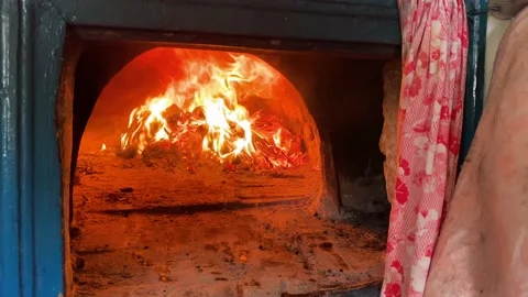 Cooking on the fire of a home rustic oven chowder soup in a pot. Stock Footage 231315449