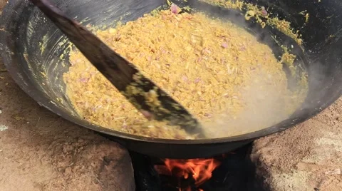 Cooking on a fire in the open air. So feed merchants at the fair. Bagan. Myanmar Stock Footage 66510134