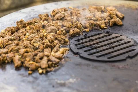 Cooking on the fire plate Stock Photos