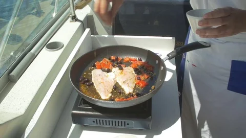 Cooking fish in the boat Stock Footage 71376360