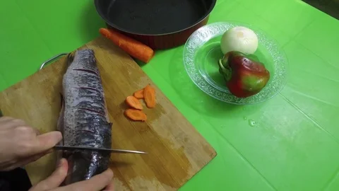 Cooking fish carp. Cuts the head of a fish 2 Stock-Footage 79630087