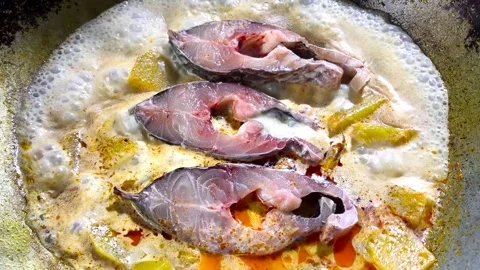 Cooking fish curry with pumpkin Stock Footage 318113803