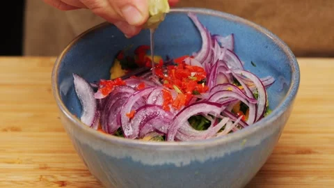 Cooking fish Peruvian ceviche close-up. Fresh cooked ceviche made of raw white Stock Footage 289658555