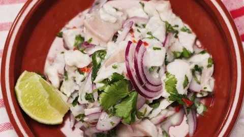 Cooking fish Peruvian ceviche close-up. Fresh cooked ceviche made of raw white Stock-Footage 289658888