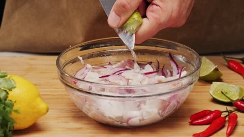 Cooking fish Peruvian ceviche close-up. Fresh cooked ceviche made of raw white Stock Footage 290230806