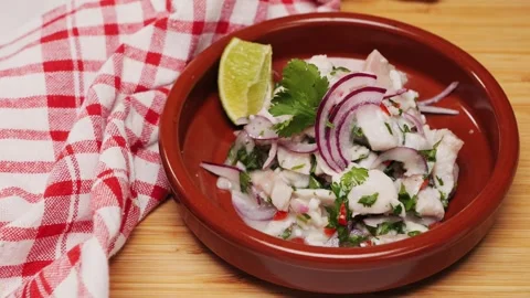 Cooking fish Peruvian ceviche close-up. Fresh cooked ceviche made of raw white Stock Footage 290230845