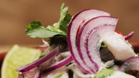 Cooking fish Peruvian ceviche close-up. Fresh cooked ceviche made of raw white Stock Footage 290230883