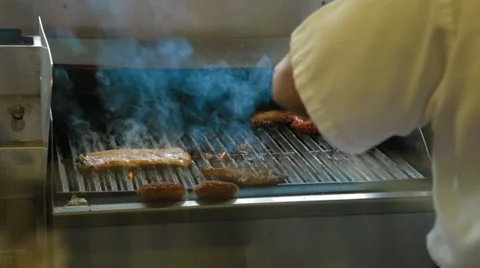 Cooking Fish on a Restaurant Grill Stock Footage 42710745