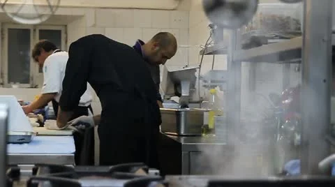  Cooking fish in a restaurant kitchen Video stock 12032682